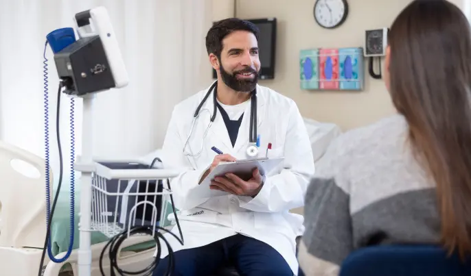 Man with clipboard and stethoscope