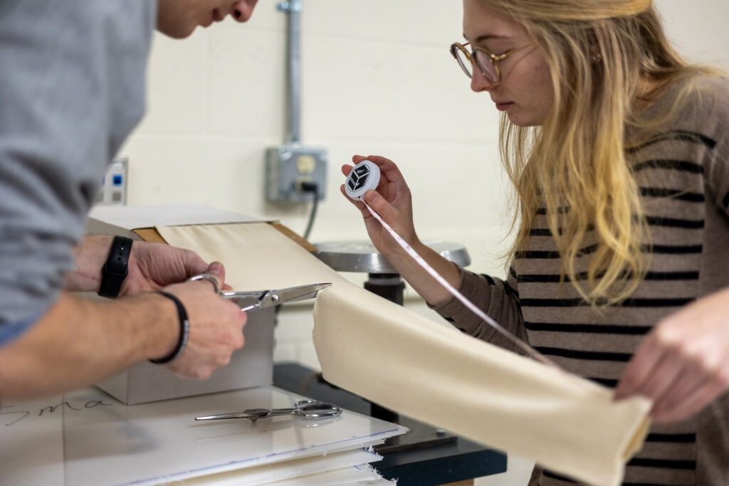 Student and professor working together to create a prosthetic limb.