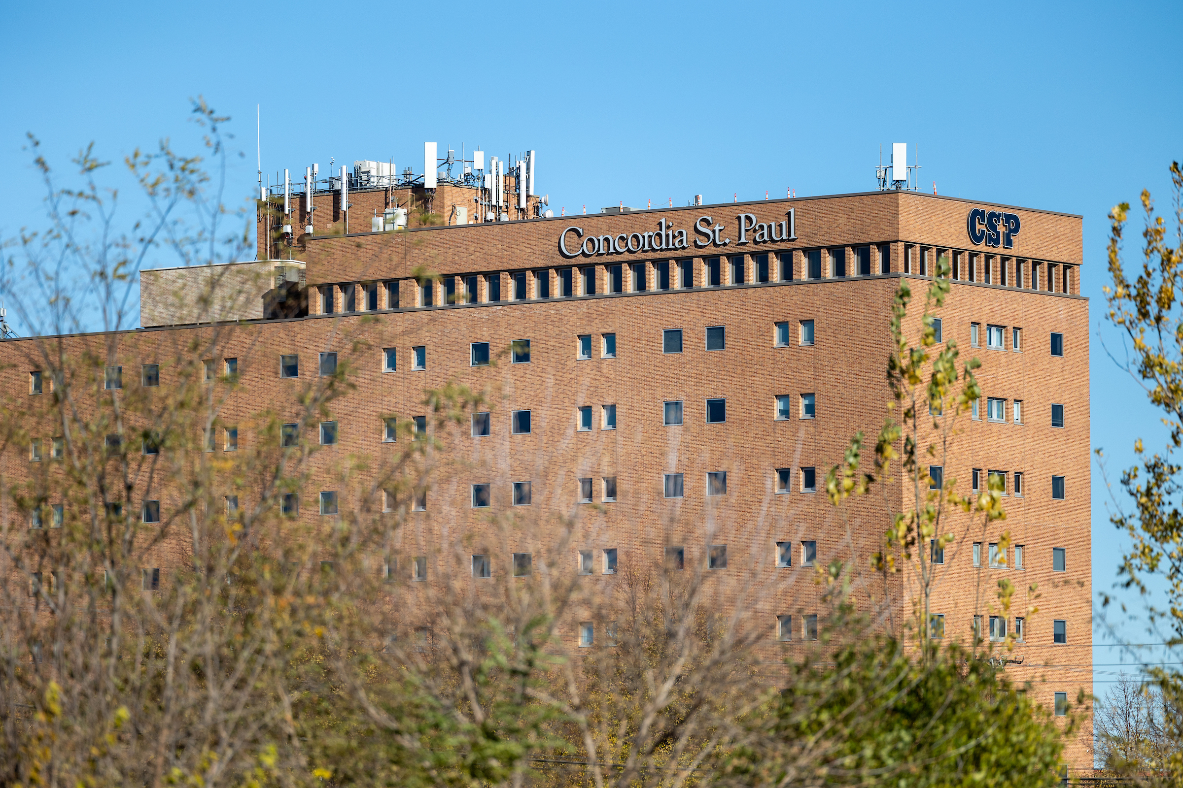 Tall tan and brown building with "Concordia St. Paul and "CSP" graphics on it.